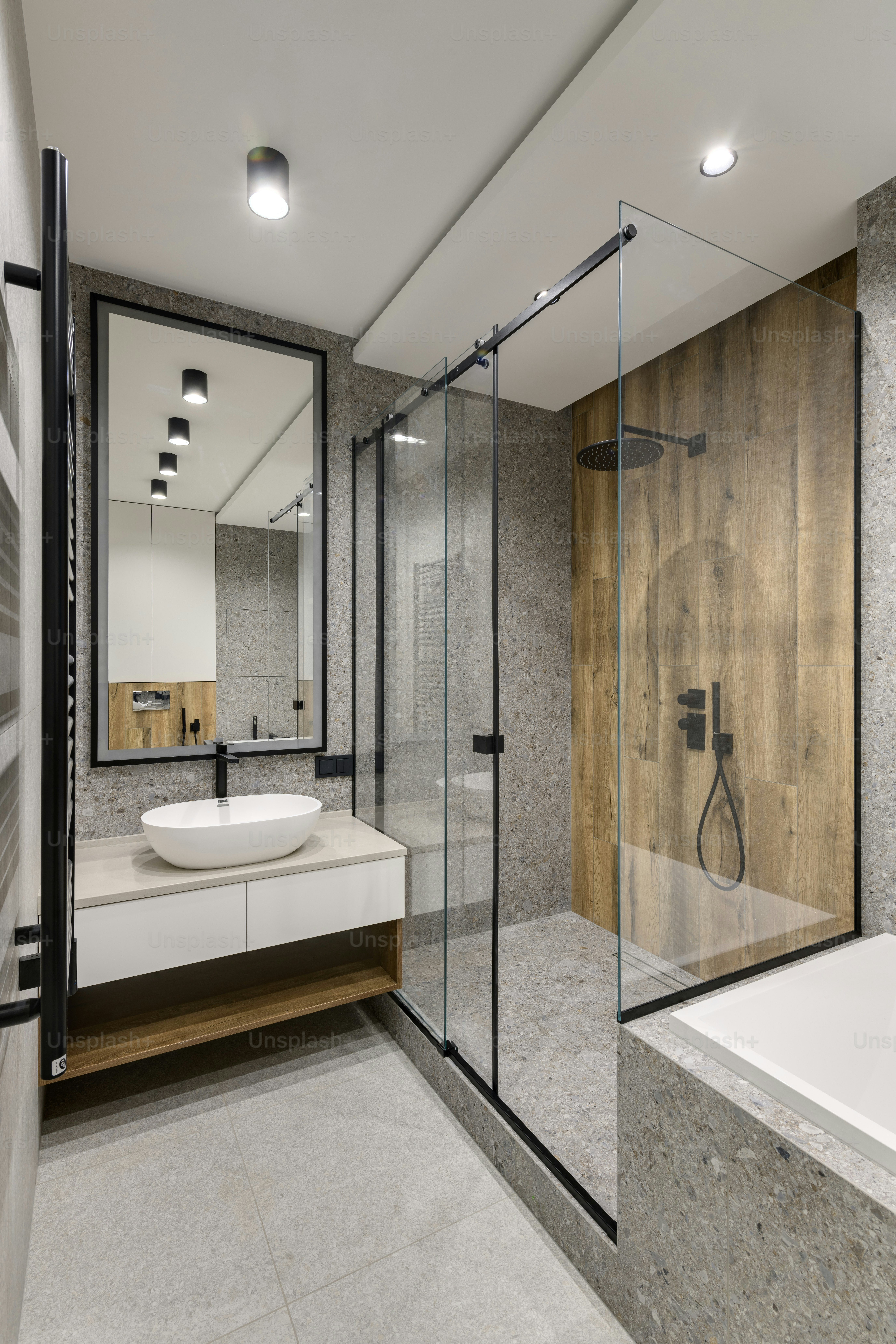 a bathroom with a sink, mirror, and bathtub